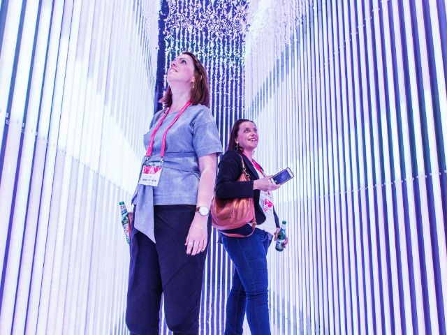 Crowd inside a showroom display